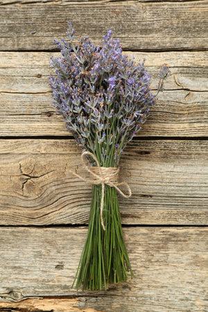 Bunch of lavender flowers on wooden table, top viewの写真素材