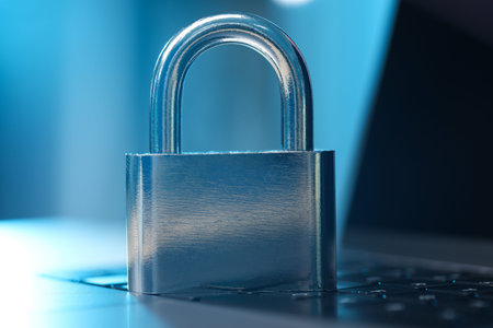 Cyber safety. Metal padlock on laptop, closeupの写真素材
