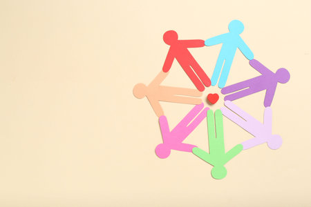 Tolerance concept. Colorful human figures and heart on beige background, flat lay. Space for text