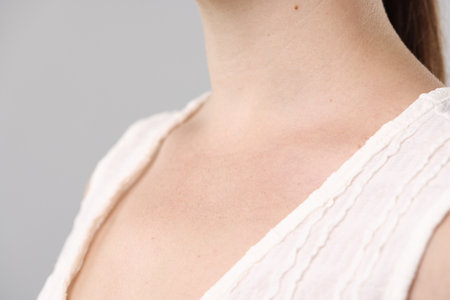 Closeup view of woman on light grey backgroundの写真素材