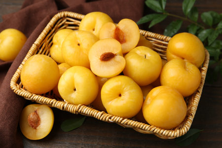 Ripe yellow cherry plums on wooden table, closeupの写真素材