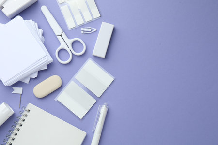 Different white stationery on violet background, flat lay. Space for text