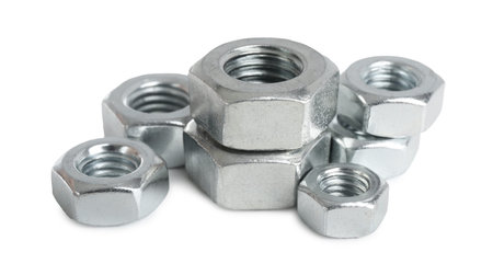 Metal hex nuts isolated on white. Hardware tool