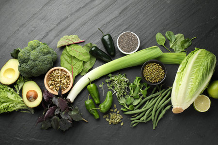 Superfood. Healthy food products on black table, flat lay