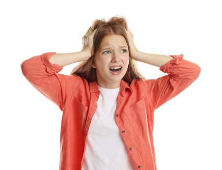 Teenage girl suffering from panic attack on white backgroundの写真素材