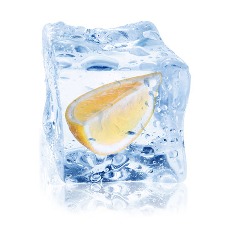 Cut fresh lemon fruit in ice cube isolated on whiteの写真素材