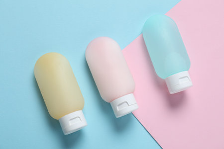 Cosmetic products on color background, flat lay. Mockup for designの写真素材