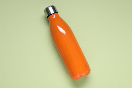 Water bottle on light green background, top viewの写真素材