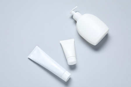 Cosmetic products on light background, flat lay. Mockup for designの写真素材