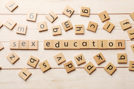 Words Sex Education made of squares with letters on wooden table, flat layの写真素材