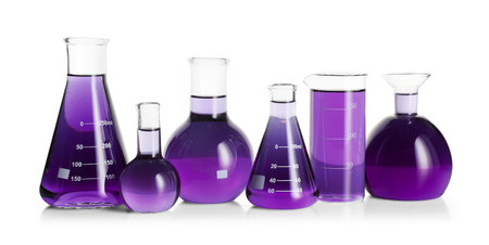 Laboratory glassware with violet liquid isolated on whiteの写真素材