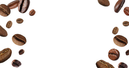 Roasted coffee beans flying against white backgroundの写真素材