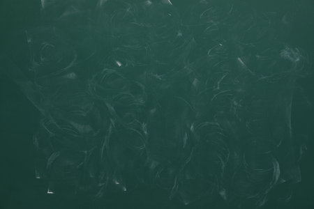 Dirty green chalkboard as background. School equipmentの写真素材
