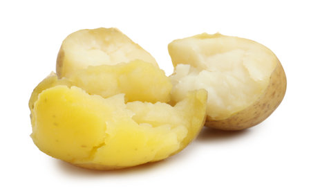 Pieces of young boiled potatoes isolated on whiteの写真素材