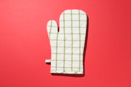 One oven glove on red background, top viewの写真素材