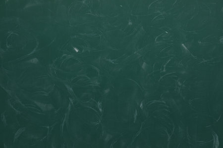 Dirty green chalkboard as background. School equipmentの写真素材