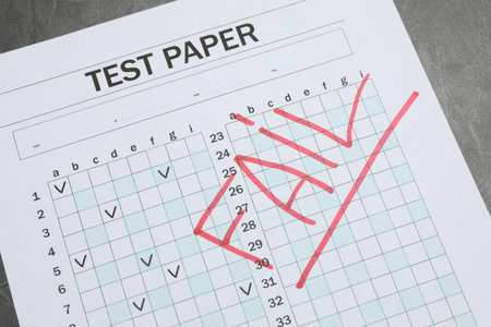 Answer sheet on gray table, above view. Student passing examの写真素材