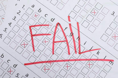 Word Fail written with red marker on answer sheet, top view. Student passing examの写真素材