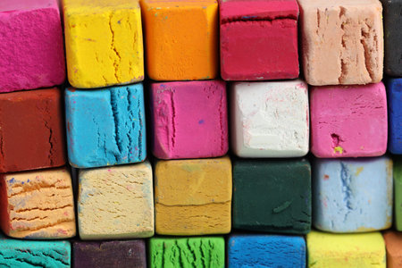 Many colorful chalk pastels as background, closeup