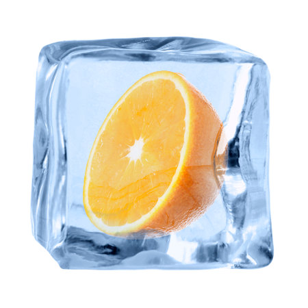 Half of fresh orange inside ice cube on white backgroundの写真素材