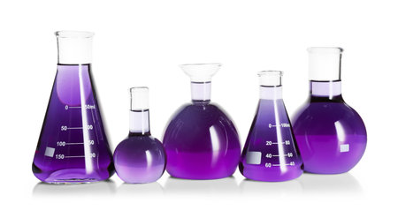 Laboratory glassware with violet liquid isolated on whiteの写真素材