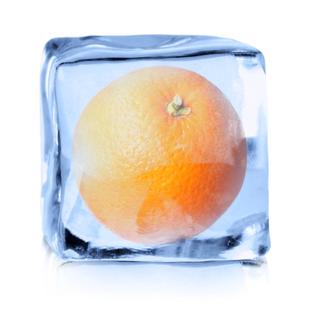 Fresh orange inside ice cube on white backgroundの写真素材