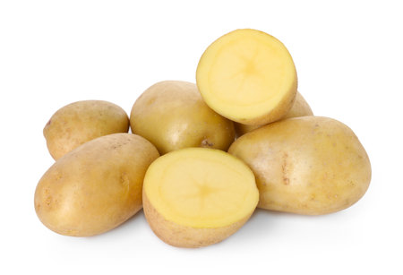 Many fresh ripe potatoes isolated on whiteの写真素材