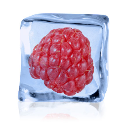 Ripe raspberry in ice cube on white backgroundの写真素材
