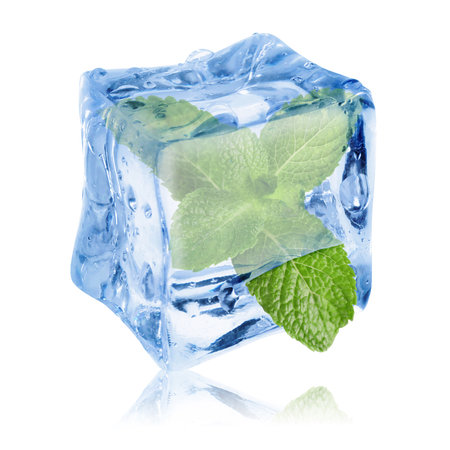Fresh mint leaves inside clear ice cube on white backgroundの写真素材
