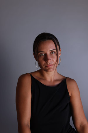 Portrait of beautiful woman on grey background