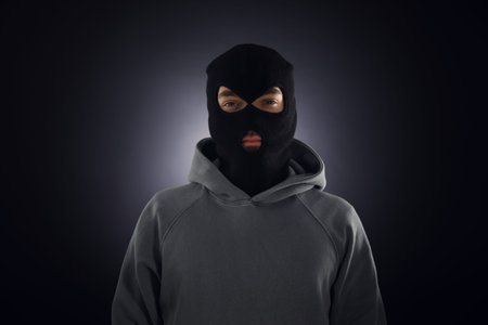 Man in mask on dark background