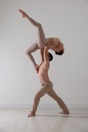 Couple of professional dancers training in studioの写真素材