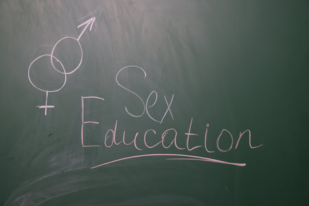 Words Sex Education and gender symbols on green chalkboardの写真素材