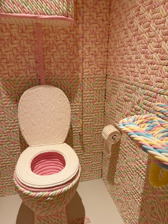 Wassenaar, Netherlands - June 28, 2025: Installation with bathroom made of candies at Voorlinden...