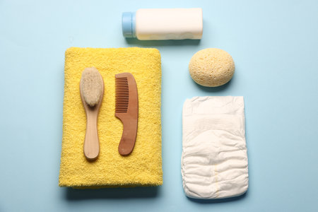 Baby bath accessories on light blue background, flat layの写真素材