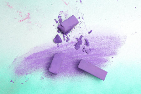 Violet chalk pastels and scribble on color background, flat layの写真素材