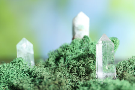 Healing stones on green moss against blurred background, closeupの写真素材