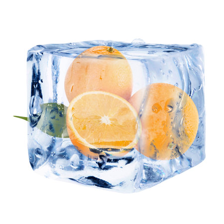 Fresh oranges inside ice cube on white backgroundの写真素材