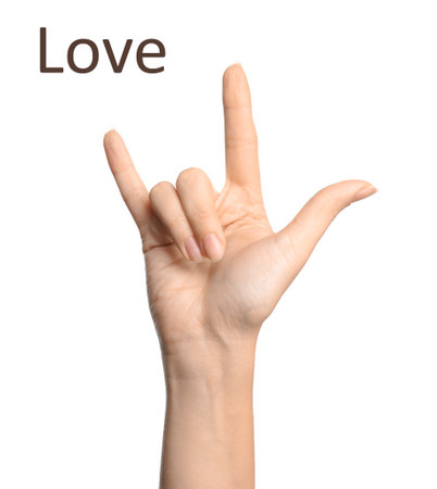 Woman showing word Love on white background, closeup. Sign languageの写真素材