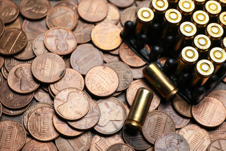 Many firearms cartridges on coins, closeup viewの写真素材