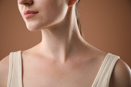 Closeup view of woman on brown background