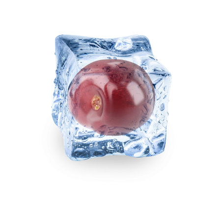 Fresh grape in clear ice cube isolated on whiteの写真素材