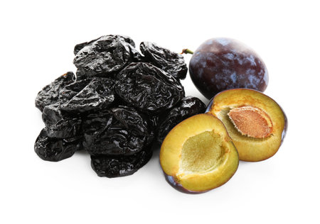 Dried prunes and fresh plums isolated on whiteの写真素材