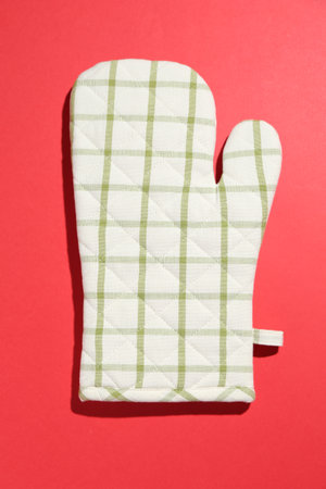 One oven glove on red background, top viewの写真素材