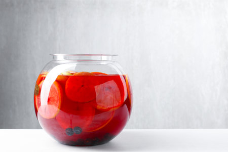 Tasty fruity punch on white table, space for text. Refreshing drinkの写真素材