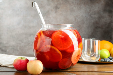 Tasty punch and fruits on wooden table. Refreshing drinkの写真素材