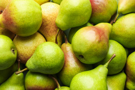 Many whole ripe pears as background, closeupの写真素材