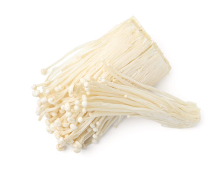 Fresh enoki mushrooms isolated on white, top view