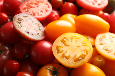 Different ripe juicy tomatoes as background, closeupの写真素材