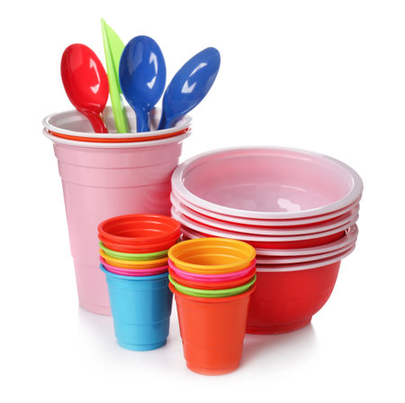 Set of disposable plastic dishware isolated on whiteの写真素材